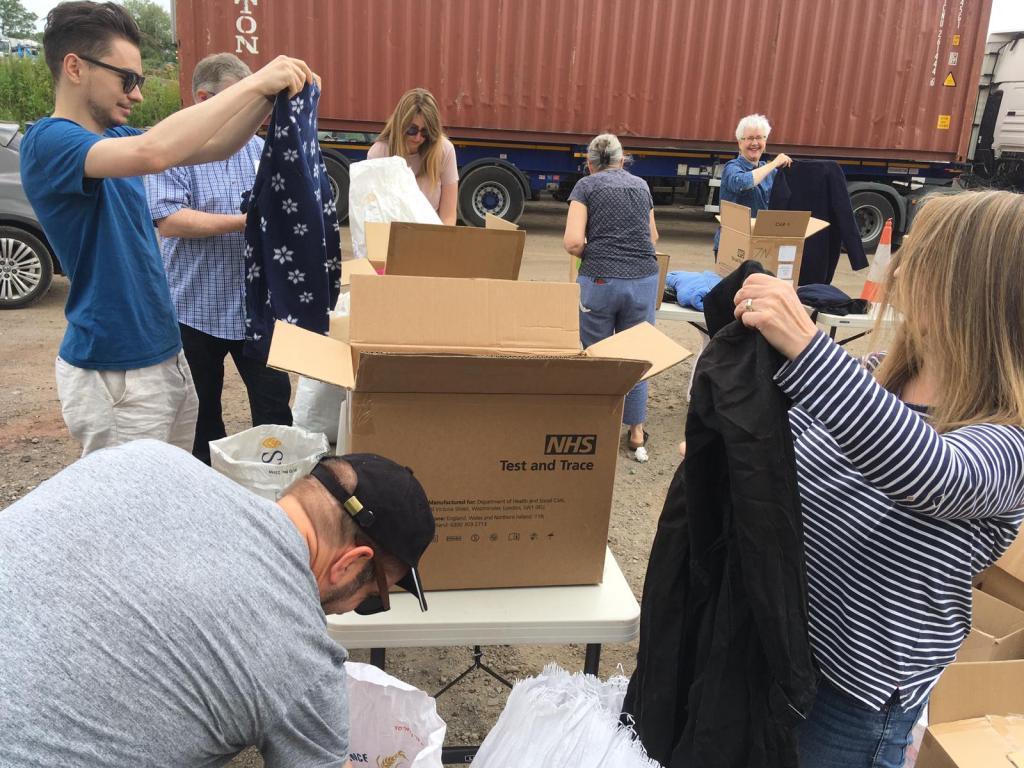 Packing session people helping to pack donations