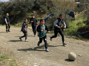 boys playing football